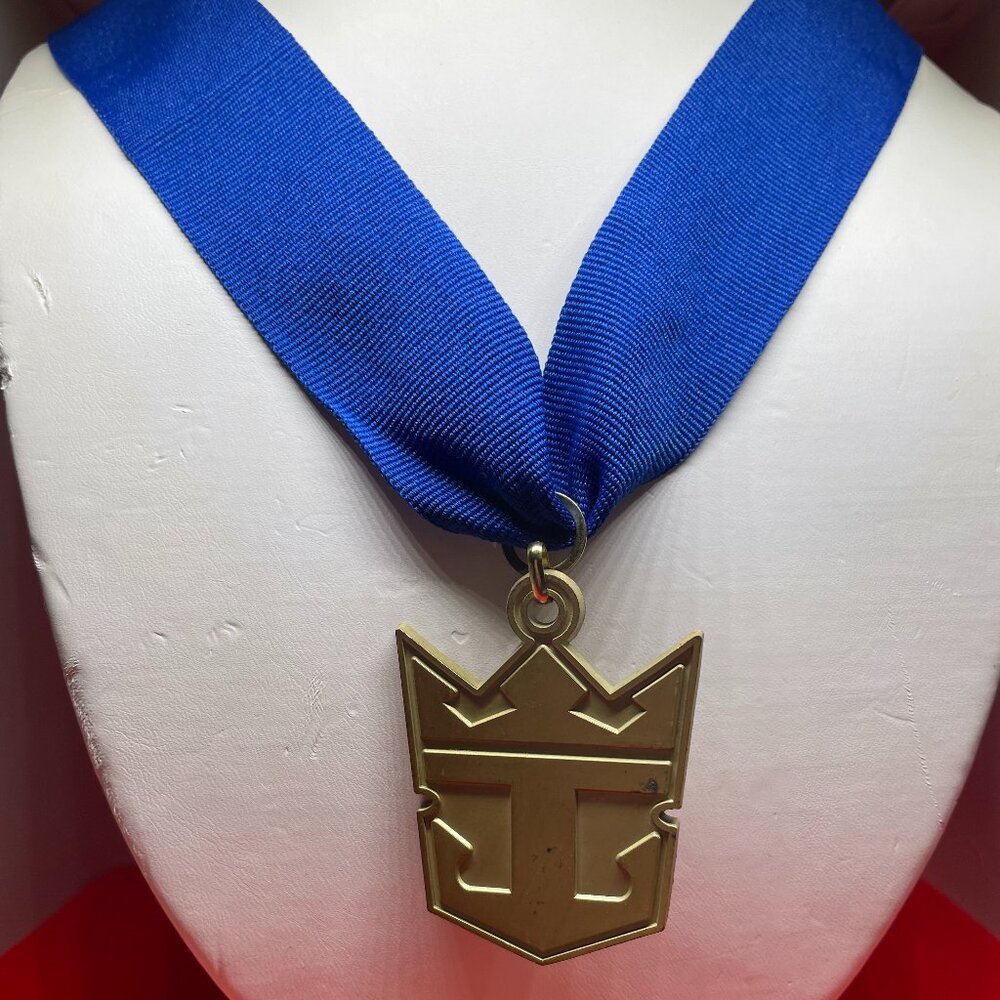 Royal Caribbean International gold tone award medal